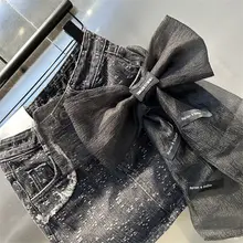 立体的な大きなリボンデザインのデニムミニスカート【メッシュ生地・フィットスタイル】（セットアップ対応）