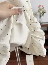 通勤スタイルにぴったり！水玉模様のノースリーブワンピース【バタフライリボン・スクエアネック・フラワーバルーンスカート】