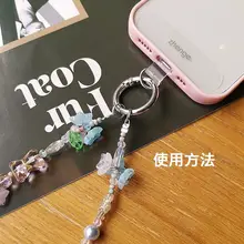 個性的なスズランの花デザインのスマホストラップ【高級感あるビーズ付き・女性向け・防止用】