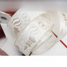 オレンジ色の古典的な装飾リボン【金縁・雪の結晶・花柄デザイン】