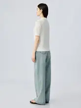 肌理のある穴あけデザインの半袖ニットポロシャツ
