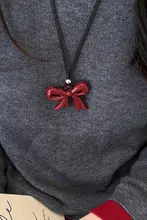 愛らしいリボンデザインのハートネックレス【長めの黒紐・お洒落なニットアクセサリー】