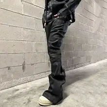 高街スタイルの黒色コーティングストレッチデニムパンツ【極上の柔らかさ・フレアデザイン・長丈】