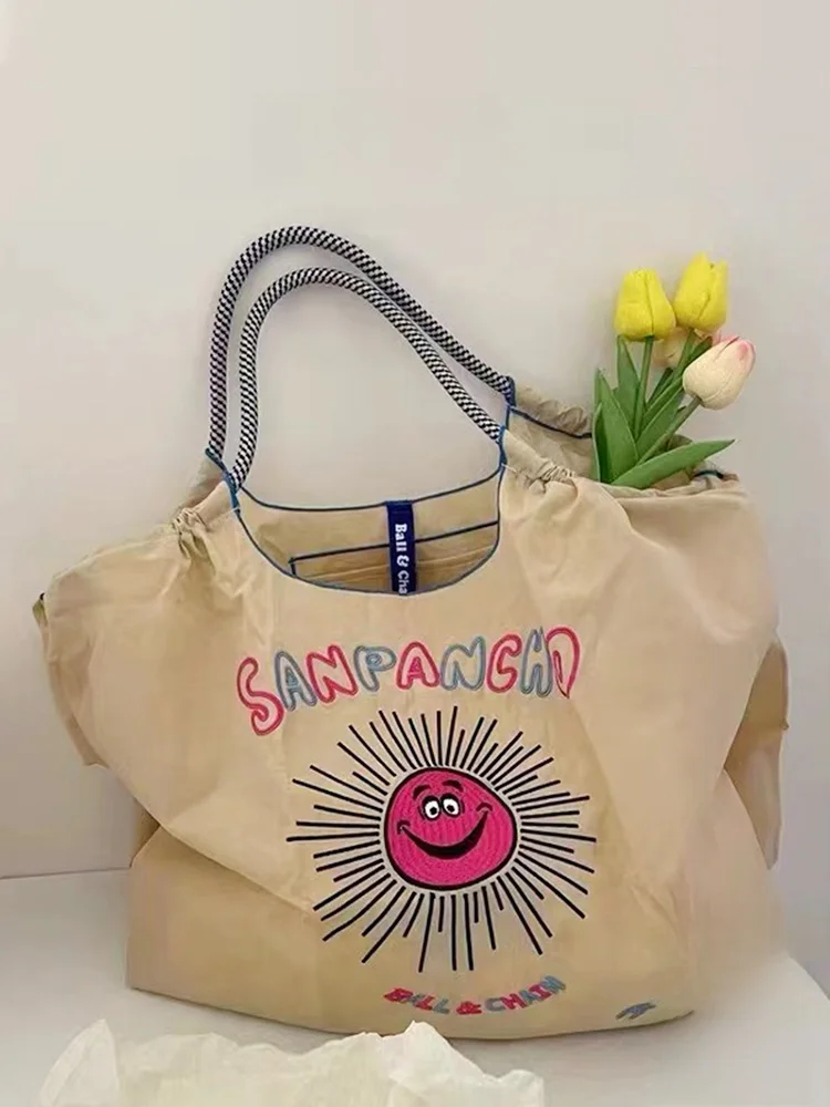 刺繍入りキャンバスショッピングバッグ：ひまわりデザインで折りたたみ可能な日常使いの実用性