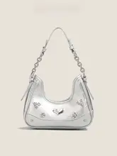 シルバーのアシンメトリーデザインのショルダーバッグ【斜め掛け・女性用・ユニークスタイル】