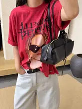 ヴィンテージ風の水洗いコットンTシャツ【インパクトのあるプリント・ダメージデザイン・ゆったりシルエット】