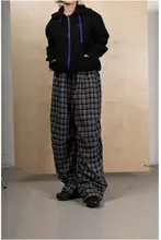 クラシックな黒白チェック柄のウエストゴム男女兼用ワイドパンツ