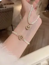 パールデザインの八方向星型ロザリオブレスレット【クリスタル装飾・女性用・高級感あるデザイン】