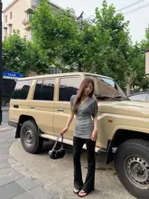 ブラックのフレアパンツ【夏用・低ウエスト・スリム効果・接ぎ合わせ・高伸縮性・カジュアル】
