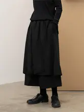 不規則な多層デザインの九分丈ワイドパンツスカート