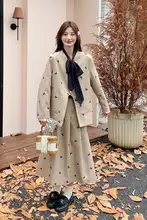 デザイン性のある優しい印象のプリント蝶結びスーツスカート【秋用・二分丈】（セットアップ対応）