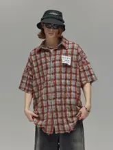 廃墟風オレンジチェック柄半袖シャツ【ルーズフィット・フリンジデザイン】