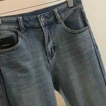 愛心ボタン付きスリムフィットデニムパンツ【毛羽立ち裾・サイドスリット・春用】（セットアップ対応）