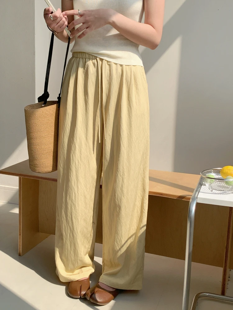 白色ゆったりカジュアルハイウエストワイドパンツ：夏用の通気性と百搭性を実証