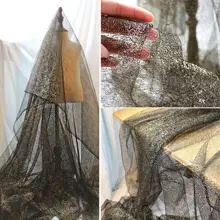 黒金色の不規則な穴空きテクスチャーのメッシュ生地【透視効果・ドレスデザイン用】