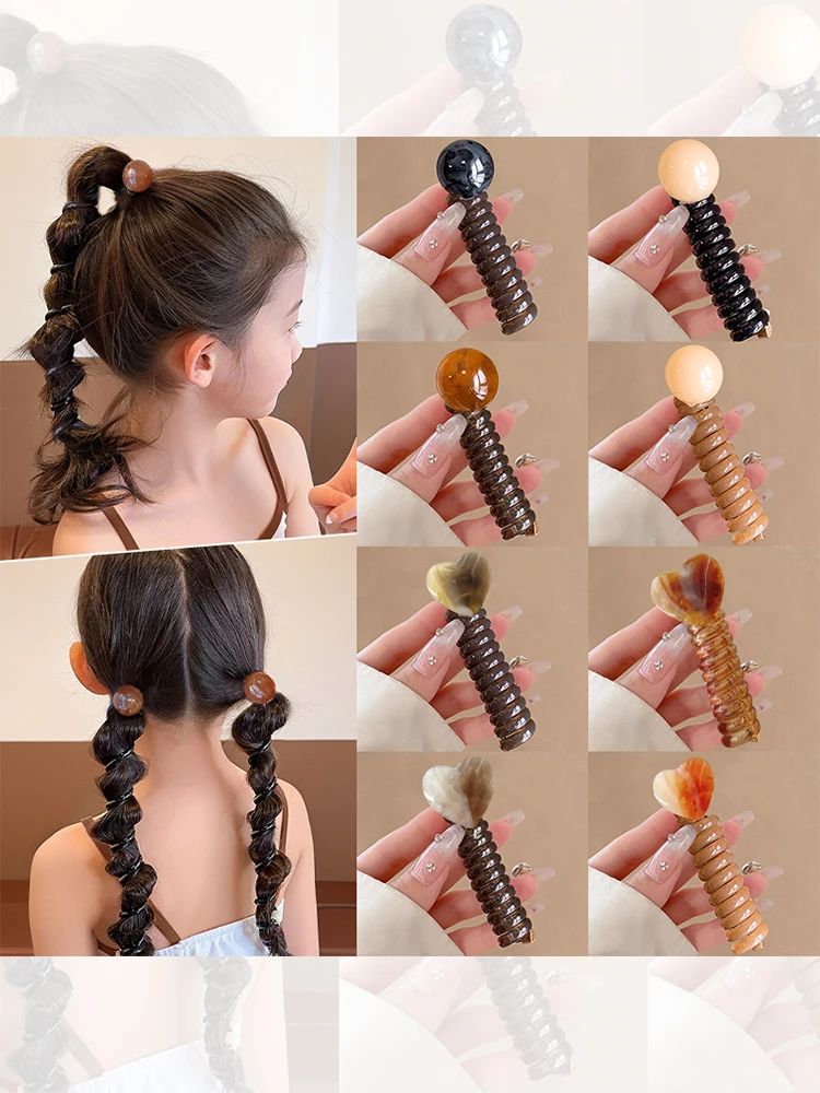 こぶ結びの定番アイテム：レトロな電話線風ヘアゴムの実用性と使い方