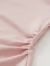 春らしい粉色の長袖Tシャツ【リボン付き・ウエストシェイプ・女性用】