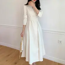春の気品を演出！長袖のテーラードワンピース【無地・カシュクール・膝下丈・ウエストリボン】