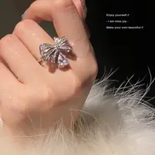 Joy 蝶結びデザインの水滴型リング【立体ラメ・軽やかで華やか】