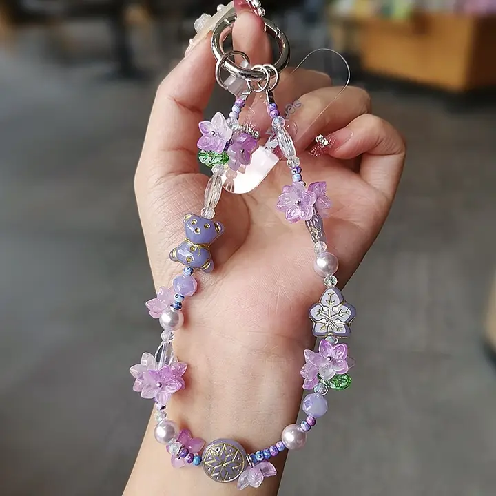 個性的なスズランの花デザインのスマホストラップ【高級感あるビーズ付き・女性向け・防止用】