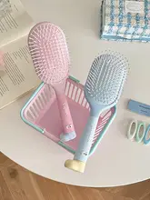 軽量でかわいい！頭皮マッサージ機能付きヘアブラシ【ポンポンスタイル・携帯便利】