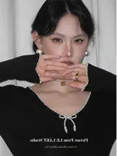 パール装飾付き バタフライリボン 長袖ニットトップス【春用・女性・タイトフィット】