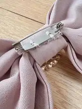リボンデザインのブローチ【水晶飾り・ピンク・ファッションアクセサリー】