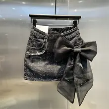 立体的な大きなリボンデザインのデニムミニスカート【メッシュ生地・フィットスタイル】（セットアップ対応）