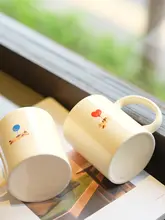 バルーン猫デザインの陶器製マグカップ【ハンドル付き・かわいらしいコーヒーカップ】