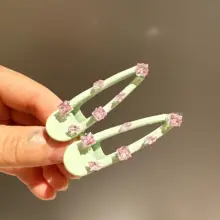 薄荷グリーンのリボンデザインヘアクリップ【キラキラしたジルコン・高級感】