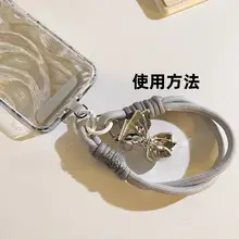 銀色のリボンデザイン携帯電話ストラップ【ブラックボタン・短め・スマホ用・韓国風・便利なアクセサリー】（セットアップ対応）