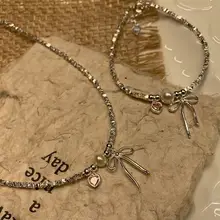 美しいリボンデザインのパールネックレス【鎖骨チェーン・春夏用・高級感あり】