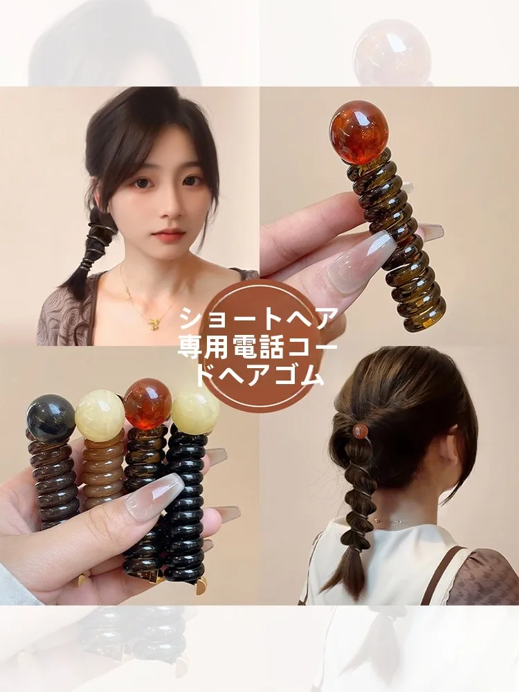 こぶ結びの定番アイテム：レトロな電話線風ヘアゴムの実用性と使い方