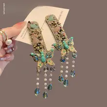 水晶バタフライデザインのヘアクリップ【流れるフリンジ・サイド用・前髪整理】