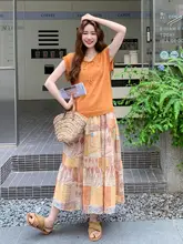 レトロなフレンチスタイルのコーディネート【リボン付きニットタンクトップ・花柄のスカート・セットアップ対応】
