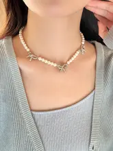 気品あるデザイン！パール付きリボンネックレス【シルバー・鎖骨チェーン】