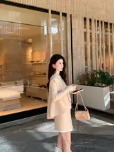 ニットベストとAラインスカートの秋冬コーディネート（セットアップ対応）