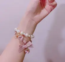 可愛い二重リボンデザインのパールビーズブレスレット【水晶装飾・女の子向け】