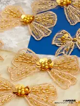 輝く金色のラメとパールのネット生地刺繍リボン【ローズゴールド・服飾用装飾布】