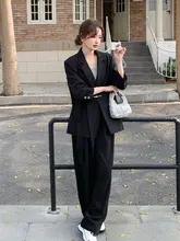 洗練されたデザインの黒ビジネススーツ【広がったパンツ・エレガントなスタイル】（セットアップ対応）