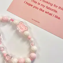 かわいいピンクのパール小熊付きスマホストラップ【短め・手首用・ビーズデザイン・頑丈な吊り紐】