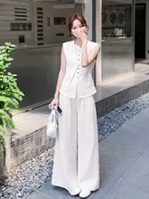 大人の魅力漂うノースリーブジレとワイドパンツのコーディネート（セットアップ対応）