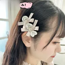 銀色のハート型リボンデザインの水晶バンスクリップ【可愛い・手作り・女性用】