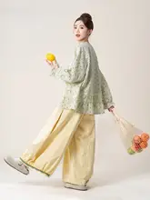 グリーンドット柄刺繍ブラウス【透かしデザイン・フリル裾】