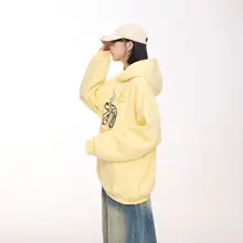アメリカンカートゥーンデザインのイエロー フード付きスウェットシャツ【秋用・ゆったり・ヴィンテージスタイル・長袖】