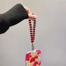 アートデザインのピンクハート手首飾り付きiPhoneケース【適用モデル・シリコン・衝撃吸収・レンズスタンド付き】