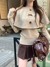 冬の優雅さを演出するバタフライノットケープニットトップ【韓国風・極上の柔らかさ・2点セットアップ対応】
