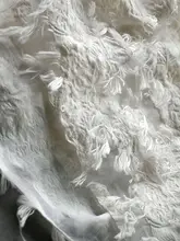 リボンデザインの透かし編み立体感のある生地【米白・輸入デザイン】