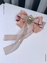 レース付きピンクのリボンブローチ【ストーン装飾・学生スタイル】