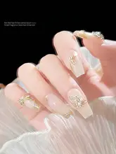 立体リボンデザインの金属製ネイル装飾品【シルバー・ストーン付き】